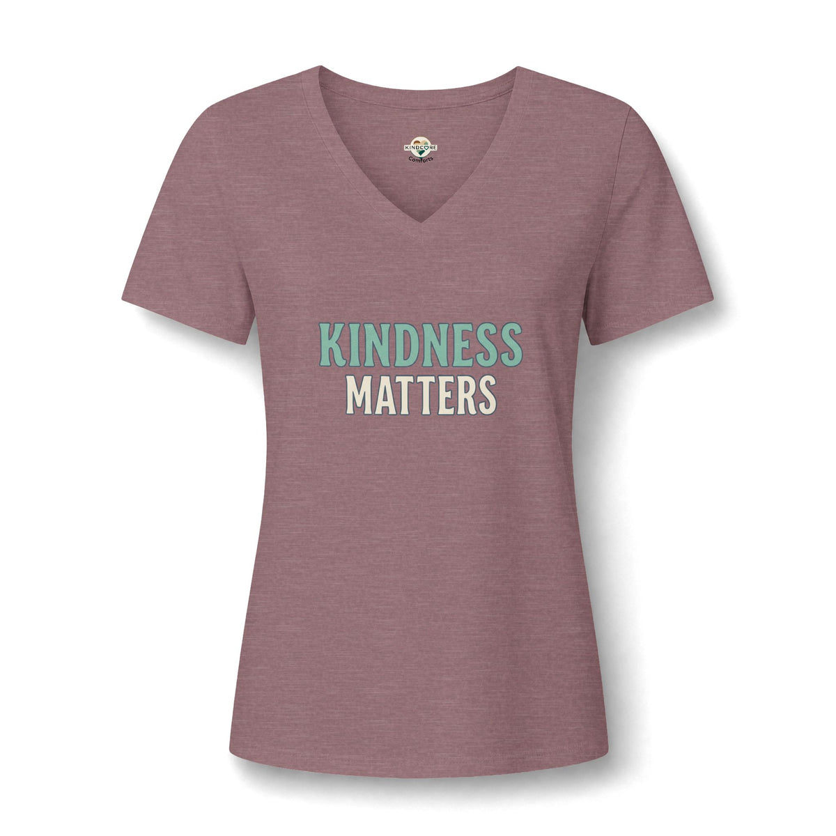 A women's heathered dusty rose V-neck t-shirt with the text 'KINDNESS MATTERS' printed on the chest.